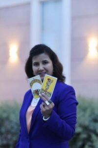 Numerologist Ruhii Rai holding tarot cards – expert in love and marriage readings based in Bhopal.