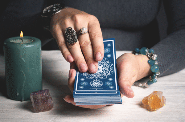 Hands preparing tarot deck for love and life reading — guided by Ruhii Rai, expert tarot reader and numerologist in Bhopal.